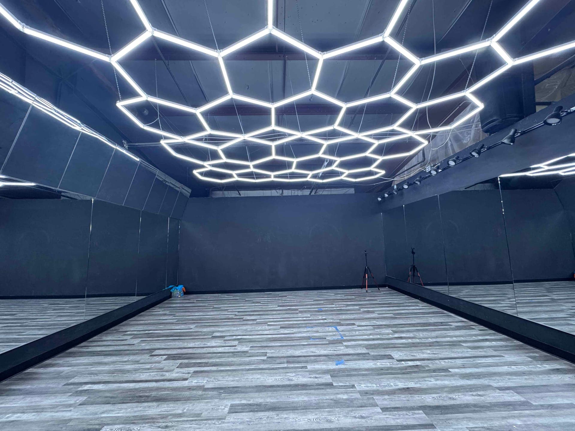 The stage-lit posing room at Colorado Iron Gym in Colorado Springs, with floor to ceiling mirrors